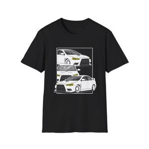 May include: Black t-shirt featuring a graphic of three white cars in a rectangular frame. The cars have yellow headlights and are depicted in a stylized, minimalist design. The shirt is made of a soft, dark fabric.