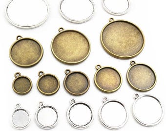May include: Assortment of round metal pendant trays in silver and bronze finishes. The trays are various sizes and are perfect for crafting jewelry or other DIY projects.