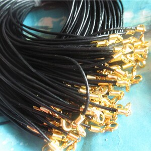 One end unattached--100pcs 11-27inch adjustable 2mm thickness black genuine(real) leather necklace cords with GOLD PLATED  lobster clasps