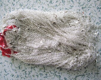 May include: A pile of silver chains with lobster clasps. The chains are tangled together and are ready to be used for jewelry making.