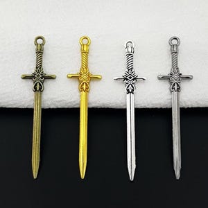 Storförsäljning - 50 st 49 x 12 mm svärdberlocker i antik silver/antik brons/blankt guld/antik guld/gunmetall