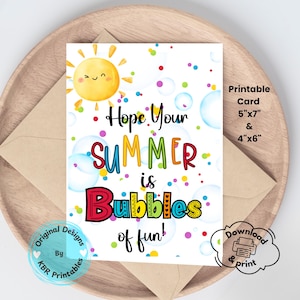 May include: A printable summer card with a cheerful sun illustration and the text "Hope Your SUMMER is Bubbles of fun!" The card is 5"x7" and 4"x6" and includes a download and print option. The card is inside a brown envelope.