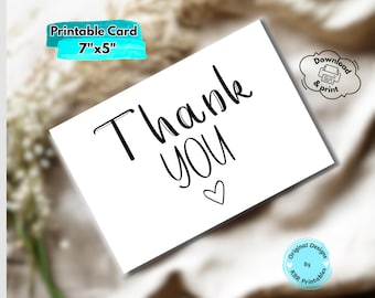 May include: A white printable card with the words "Thank You" in black script, a small heart, and the text "Printable Card 7"x5". The card also has a "Download & print" icon and a logo that says "Original Designs By KBR Printables".