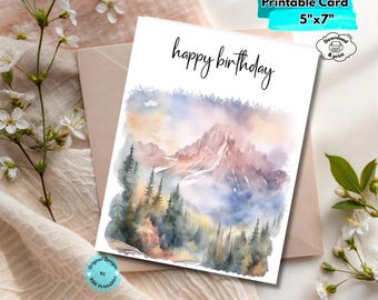 May include: A printable birthday card, 12.7cm x 17.8cm, with a watercolour mountain scene and the words "happy birthday". The card's colour palette includes blue, purple, and pink, with a forest in the foreground.