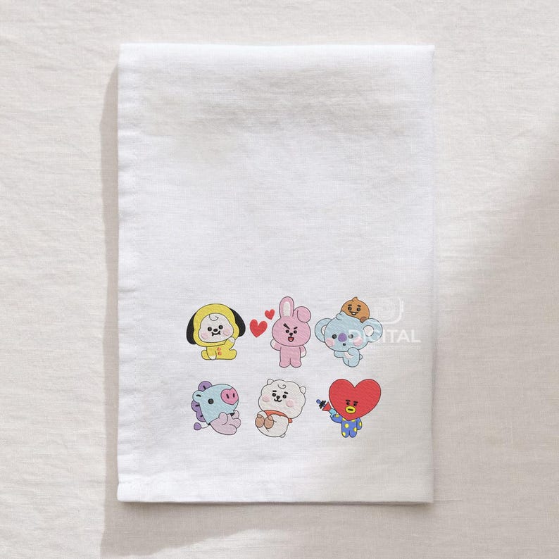 May include: White rectangular towel featuring embroidered cartoon characters in various colors. The characters include a yellow chick, a pink bunny, a blue koala, a purple horse, a white bear, and a red heart-shaped figure. The towel is made of a soft, absorbent material.