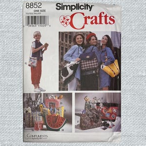 May include: Simplicity Crafts sewing pattern number 8852 for making various bags. The pattern includes instructions for making a tote bag, a crossbody bag, a watermelon-shaped bag, and a bag with a cowhide design. The pattern is for one size.