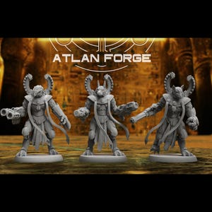 May include: Three gray miniature figures with detailed armor and weaponry. The figures have animal-like heads and are standing on circular bases. The text "ATLAN FORGE" is visible in the background.