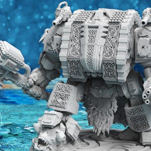 May include: A detailed, gray miniature model of a heavily armored war machine, holding a large hammer. The model features intricate Celtic knotwork and mechanical details. The base has a stylized, rocky texture. The logo "ATLAN FORGE" is visible.