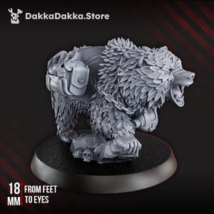 May include: A gray, detailed figurine of a bear with a backpack and chain, standing on a black base. The bear's height from feet to eyes is 18 mm. The DakkaDakka.Store logo is in the top left corner.