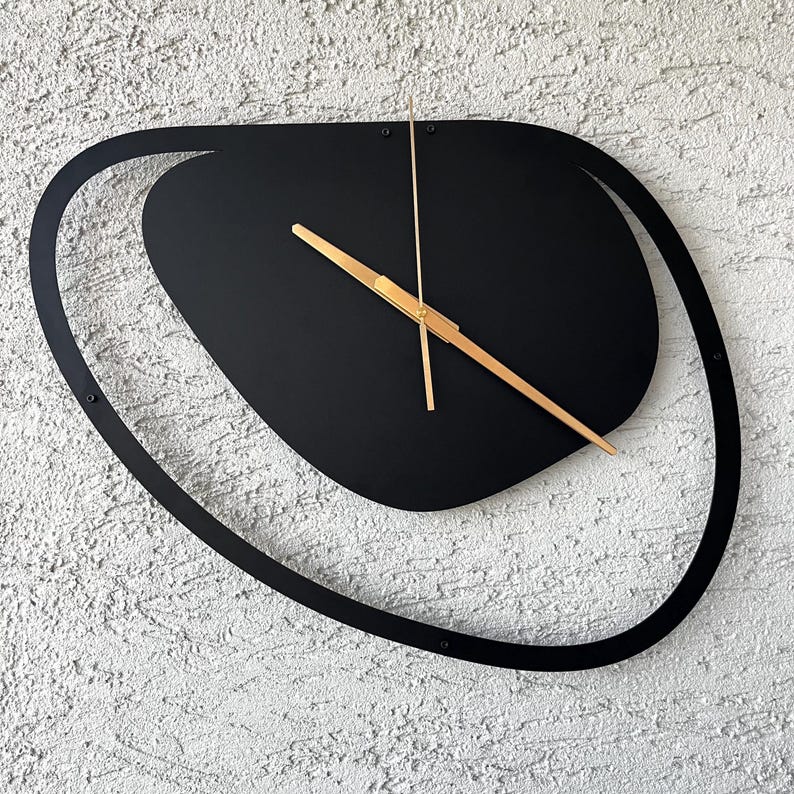 Black unique wall clock perfect for stylish interior spaces