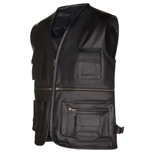 May include: Black leather vest with multiple pockets and a zipper closure. The vest has a V-neck design and a tailored fit. The text "Metaverse Apparel" is visible on the vest.