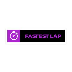 May include: A rectangular sticker with a purple square on the left featuring a white stopwatch icon. The right side is black with the words "FASTEST LAP" in purple. The sticker has a white border.