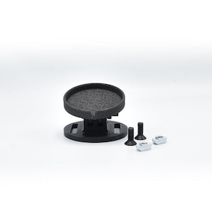 May include: A black 3D-printed circular mount with a textured top surface and a slotted base, accompanied by two black threaded bolts and two silver metal T-nuts. The components are arranged together, showing the mounting hardware clearly.