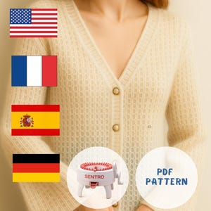 May include: A cream-coloured, open-weave cardigan with a V-neck and gold-toned buttons. A small knitting machine is visible, along with text that reads "PDF PATTERN". The cardigan is a light, neutral colour, suitable for layering.