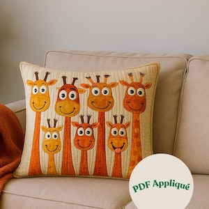 May include: A decorative pillow featuring a whimsical design of seven cartoon giraffes with orange and yellow hues. The giraffes have smiling faces and are arranged in a row. The pillow is on a beige sofa. The text "PDF Appliqué" is on the pillow.