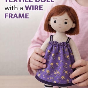 May include: A handmade textile doll with a wire frame, held by a person. The doll has a light skin tone, red hair, and is wearing a purple dress with yellow floral patterns. The doll's legs are striped black and white. Text on the image reads: "Photo step-by-step tutorial on making a TEXTILE DOLL with a WIRE FRAME."