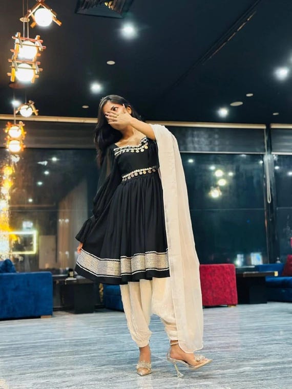 black and white dress with gold shoes What To Wear To A Black Tie Wedding