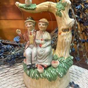 Grandma & Grandpa “Love” Swinging Music Box – Whimsical Vintage Couple Under a Tree