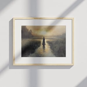May include: A framed landscape painting shows a figure in a long dress walking in a stream. The artwork uses a muted colour palette with a warm, golden sunset in the background. The painting is in a light wood frame.