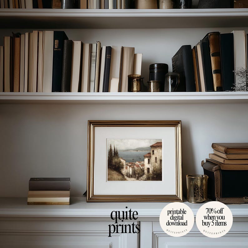 Framed printable Tuscan Countryside Oil Painting artwork in a little frame near a bookshelf | Digital download wall art with Soft tones | Vintage Vintage house poster print