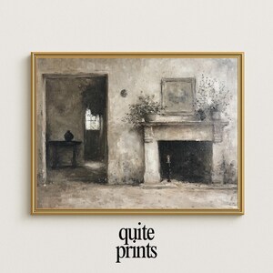 May include: A framed, sepia-toned print of an interior scene. The artwork depicts a fireplace with potted plants, a doorway, and a table. The print is in a gold frame, and the words "quite prints" are at the bottom.
