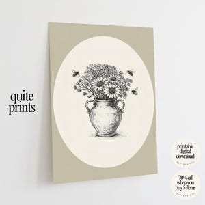 May include: A black and white illustration of a vase filled with flowers and surrounded by bees. The vase is centered in an oval shape on a beige background. The text "quite prints" is in the lower left corner.