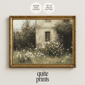 May include: A framed vintage-style print featuring a building partially obscured by lush greenery and white flowers. The artwork has a muted color palette with a gold-colored frame. The text "quite prints" is at the bottom.