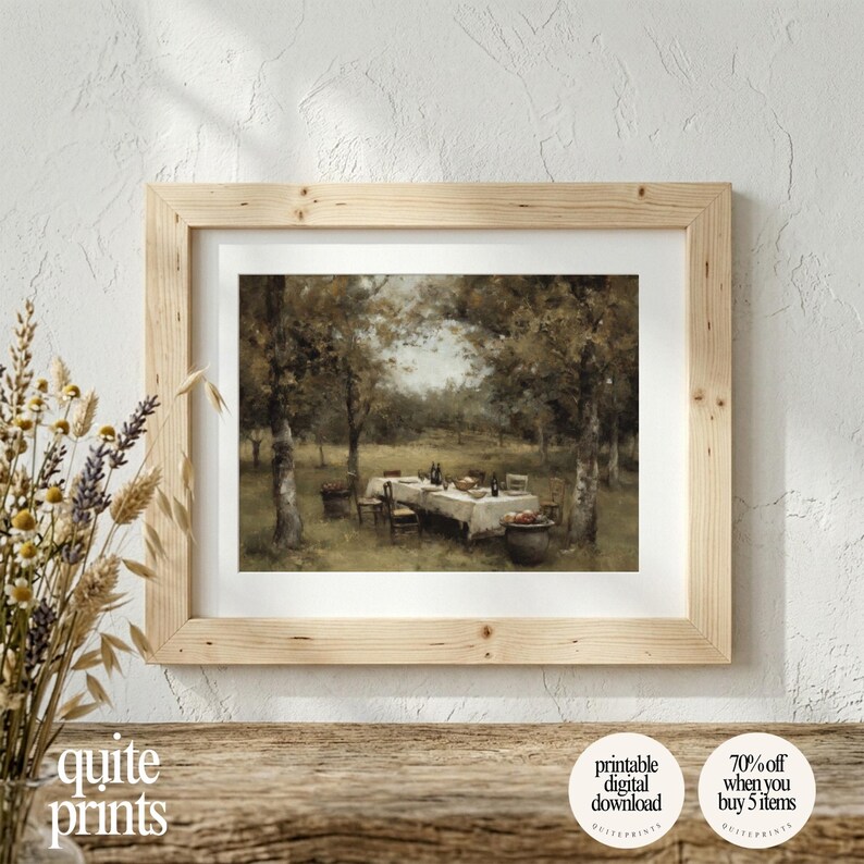 Framed printable Vintage Garden Dining Table Painting artwork in a frame on top of a wooden shelf | Digital download wall art with Soft tones | Vintage Vintage house poster print