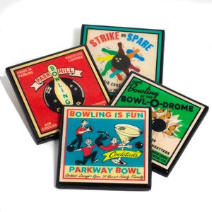 May include: Four vintage-style coasters with bowling-themed designs. The coasters are made of wood and have a black border. The designs feature bowling pins, bowling balls, and the words "Strike or Spare", "Park Hill Bowling", "Come Bowling at the Bowl-O-Drome", and "Bowling is Fun Parkway Bowl".