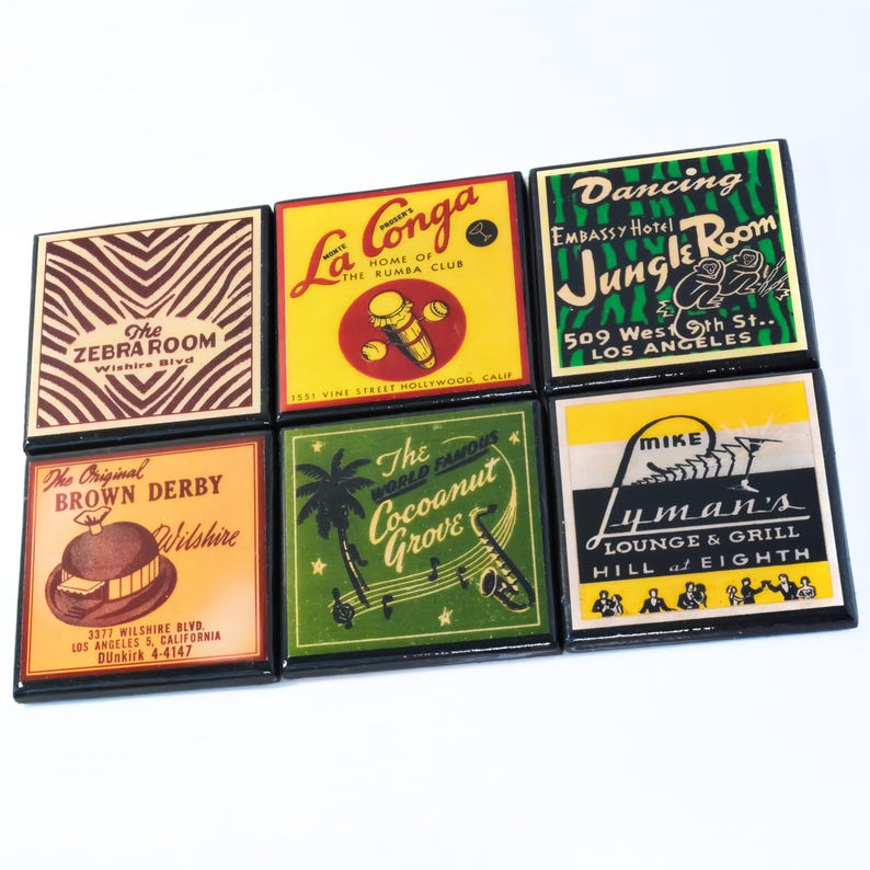 May include: Six vintage-style coasters with black frames and colorful designs. The coasters feature images and text from various businesses, including "The Zebra Room", "La Conga", "The Cocoanut Grove", "Dancing Jungle Room", "The Original Brown Derby", and "Mike Lyman's Lounge & Grill".