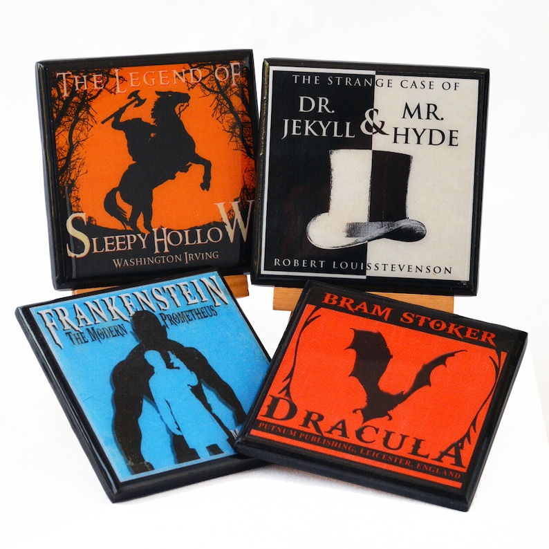 May include: Four square coasters featuring classic horror book covers. Titles include "The Legend of Sleepy Hollow," "Dr. Jekyll & Mr. Hyde," "Frankenstein," and "Dracula." Each coaster has a black border and a glossy finish.