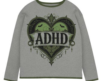 May include: A gray long-sleeve shirt with a green trim and a large heart-shaped graphic. The graphic features the word "ADHD" on a banner, with bats and decorative elements in green and black.