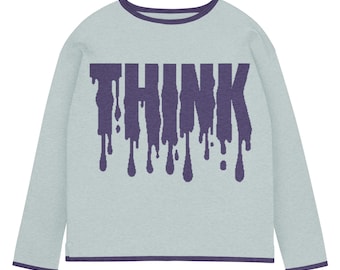 以下が含まれることがあります： 前面に紫色の滴る文字で「THINK」と書かれた、水色の長袖シャツ。 シャツは丸首で、濃い紫色のトリムが付いています。