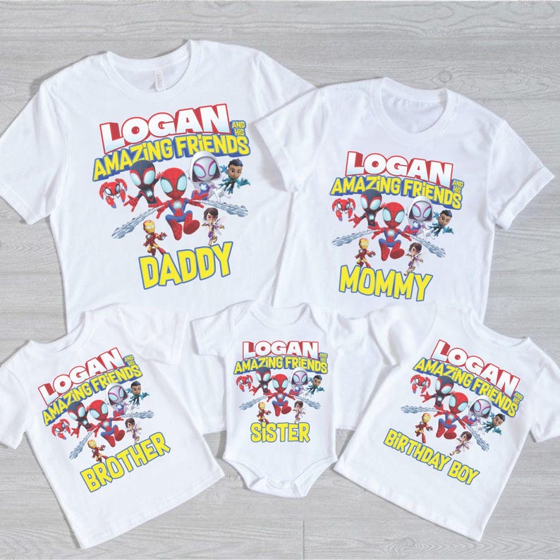 May include: White t-shirts and a onesie featuring a colorful graphic of cartoon superheroes and the text "LOGAN AND HIS AMAZING FRIENDS". The shirts are labeled "DADDY", "MOMMY", "BROTHER", "SISTER", and "BIRTHDAY BOY".