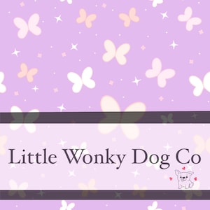 May include: A light purple background with white and peach butterflies and stars. The text "Little Wonky Dog Co" is displayed on a dark purple banner. A small cartoon dog with hearts is in the lower right corner.