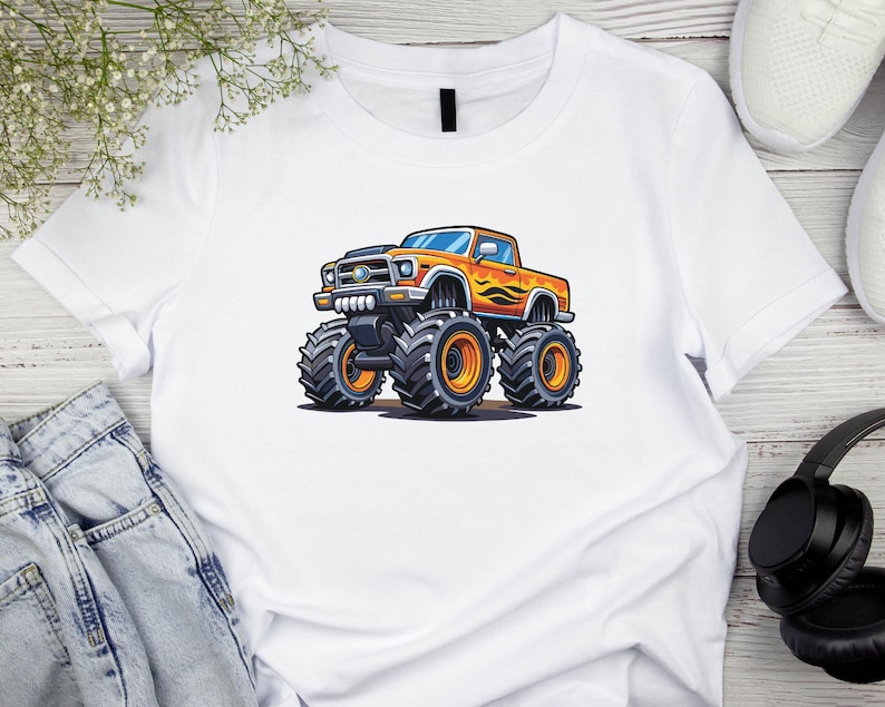 May include: White t-shirt featuring a cartoon monster truck design. The truck is orange with black tires and flames on the side. The shirt is made of a soft, comfortable material.