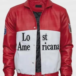 May include: Red and white leather jacket with the text "Lost Americana" on the front. The jacket has a black lining and two patches on the sleeves. The jacket has a button-up closure and a ribbed hem.