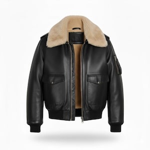May include: A black leather bomber jacket with a tan shearling collar and lining. The jacket has two front pockets, a zipped sleeve pocket, and a ribbed hem and cuffs. The jacket is designed with a zip-up front.