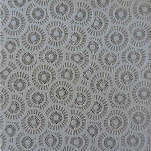 May include: Gray silicone baking mat with a repeating pattern of concentric circles. The mat has the text "Cabtopia.com 100480B" printed on the bottom.