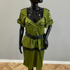 May include: A white ceramic mug with a black handle and the text "But First, Coffee" in a black, bold font. The mug is on a white surface.