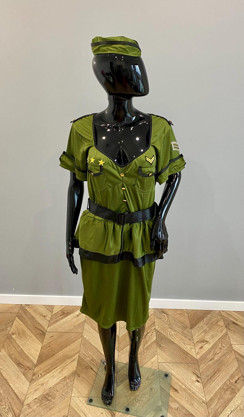 May include: A white ceramic mug with a black handle and the text "But First, Coffee" in a black, bold font. The mug is on a white surface.