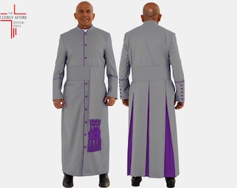 May include: A gray clergy robe with purple trim and accents. The robe features a mandarin collar, button closures, and a decorative purple tassel. The Clergy Attire logo is visible in the upper left corner.