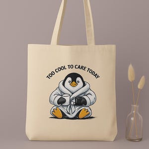 &quot;Too Cool to Care Today&quot; bag – Funny fabric bag with a chilled-out penguin in a bathrobe | Sarcastic, cozy & organic cotton | Beige