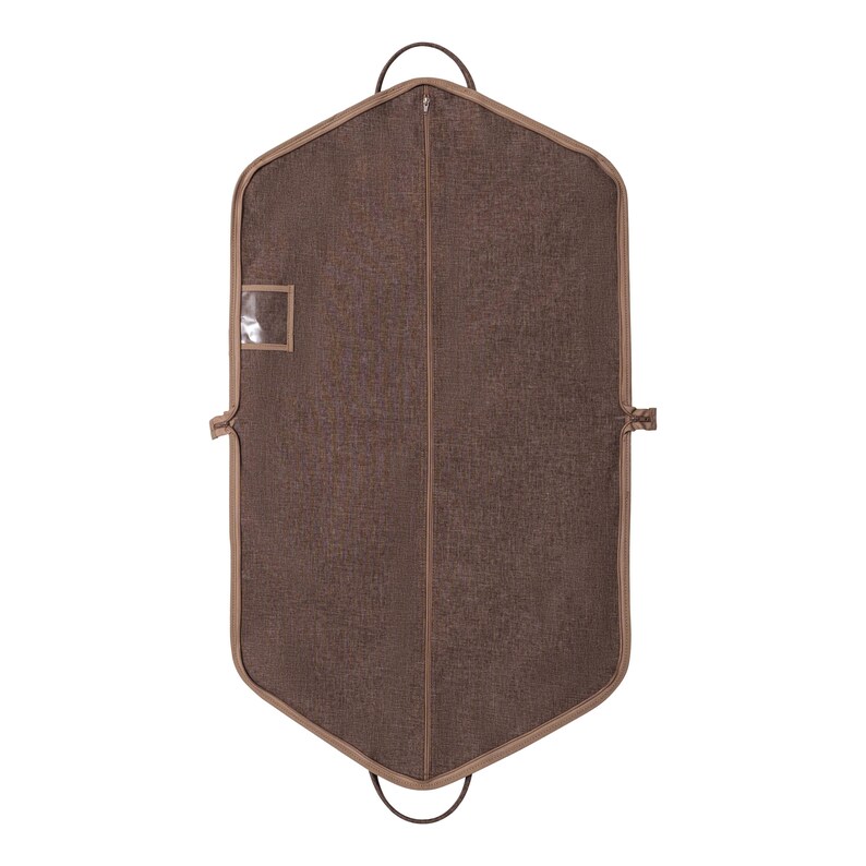 May include: A brown garment bag with a textured fabric. The bag has a full-length zipper, a small clear window, and a brown trim. It features two handles at the top and a loop at the bottom. The bag is designed to protect clothing.