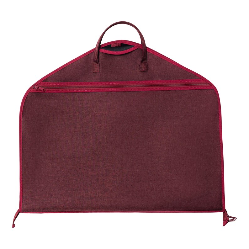 May include: A burgundy garment bag with a red zipper and trim. The bag has a handle at the top and a full-length zipper. The bag is designed to protect clothing during travel or storage.