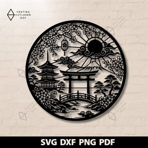 May include: Black laser-cut circular wall art depicting a Japanese landscape. The design includes a pagoda, torii gate, bridge, Mount Fuji, cherry blossoms, and a sun. The text "SVG DXF PNG PDF" is at the bottom.