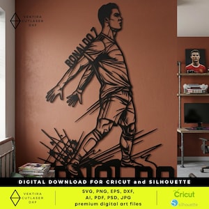 May include: A black metal wall art piece depicting a soccer player in motion, with the name "RONALDO 7" visible. The artwork is a digital download for Cricut and Silhouette, with the text "DIGITAL DOWNLOAD FOR CRICUT and SILHOUETTE" at the bottom.