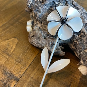 White Enameled Flower Brooch with Pretty Black Center.
