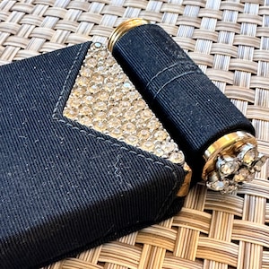 Vintage compact with lipstick incrusted with clear rhinestones in gros grain case, in great condition.