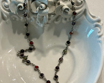 Pewter Circles Surrounding Beads in Red Black Brown and Green Necklace